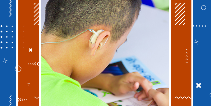 Image depicts learning Assistive Technology techniques to help children with vision and hearing disabilities succeed in early literacy